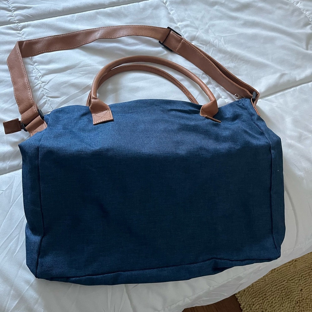 Travel bag. Jean blue with tan highlights. Large bag for computer or whatever.